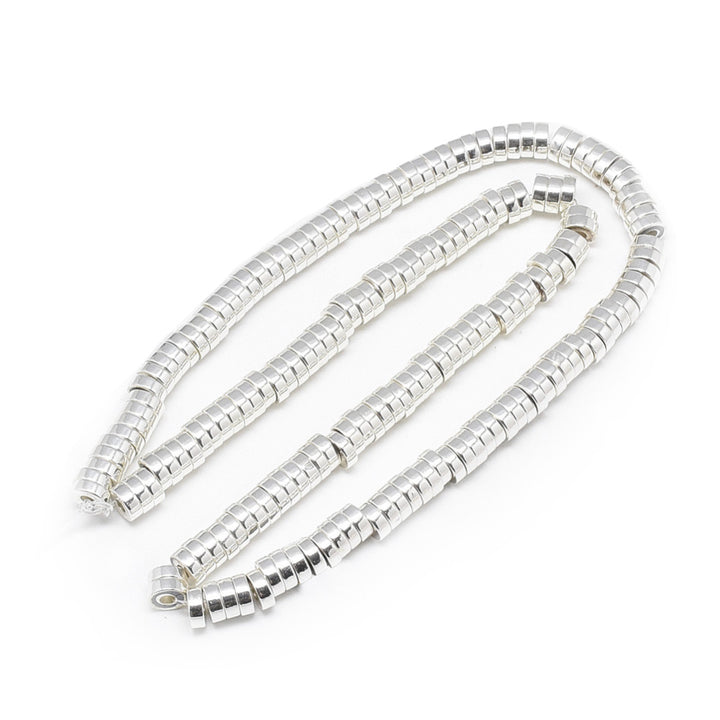 Flat Disc Shaped Electroplated Non-Magnetic Synthetic Hematite Beads, Silver Color. Semi-Precious Stone Spacer Beads for Jewelry Making. These spacers work great with polymer clay heishi beads.  Size: 6mm Wide, 2mm Thick, Hole: 2mm, approx. 170-175pcs/strand, 15.5" Inches Long.  Material: Non-Magnetic Synthetic Heishi Hematite Beads. Platinum Silver Color Plated. Flat Disc Shape. Polished, Shinny Metallic Lustrous Finish.