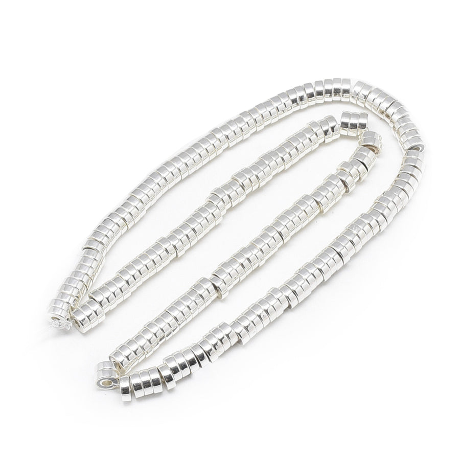 Flat Disc Shaped Electroplated Non-Magnetic Synthetic Hematite Beads, Silver Color. Semi-Precious Stone Spacer Beads for Jewelry Making. These spacers work great with polymer clay heishi beads.  Size: 6mm Wide, 2mm Thick, Hole: 2mm, approx. 170-175pcs/strand, 15.5" Inches Long.  Material: Non-Magnetic Synthetic Heishi Hematite Beads. Platinum Silver Color Plated. Flat Disc Shape. Polished, Shinny Metallic Lustrous Finish.