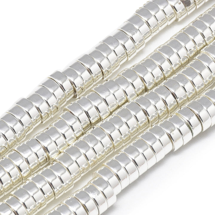 Flat Disc Shaped Electroplated Non-Magnetic Synthetic Hematite Beads, Silver Color. Semi-Precious Stone Spacer Beads for Jewelry Making. These spacers work great with polymer clay heishi beads.  Size: 6mm Wide, 2mm Thick, Hole: 2mm, approx. 170-175pcs/strand, 15.5" Inches Long.  Material: Non-Magnetic Synthetic Heishi Hematite Beads. Platinum Silver Color Plated. Flat Disc Shape. Polished, Shinny Metallic Lustrous Finish.