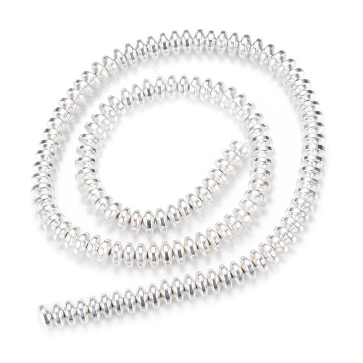 Electroplated Non-Magnetic Synthetic Hematite Beads, Silver Color. Semi-Precious Stone Spacer Beads for Jewelry Making.   Size: 6mm Wide, 3mm Thick, Hole: 1mm, approx. 125pcs/strand, 15.5" Inches Long.  Material: Non-Magnetic Synthetic Hematite Beads. Silver Color Plated. Rondelle Shape. Polished, Shinny Metallic Lustrous Finish.