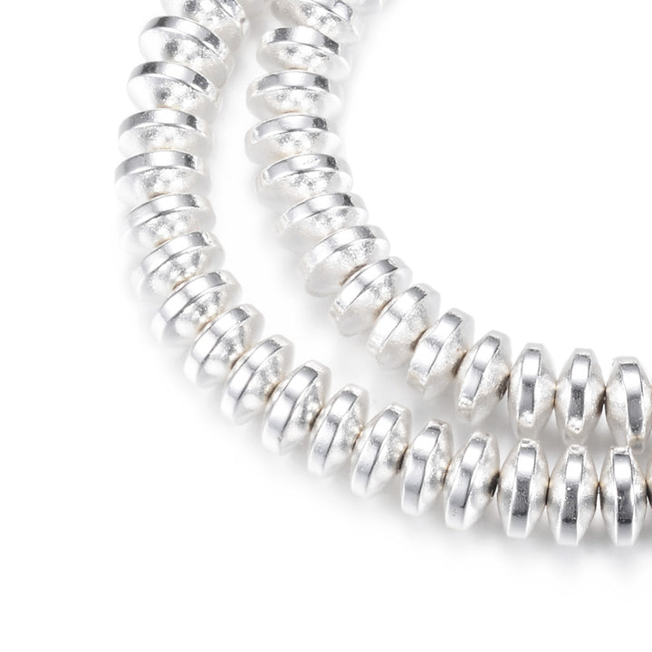 Electroplated Non-Magnetic Synthetic Hematite Beads, Silver Color. Semi-Precious Stone Spacer Beads for Jewelry Making.   Size: 6mm Wide, 3mm Thick, Hole: 1mm, approx. 125pcs/strand, 15.5" Inches Long.  Material: Non-Magnetic Synthetic Hematite Beads. Silver Color Plated. Rondelle Shape. Polished, Shinny Metallic Lustrous Finish.