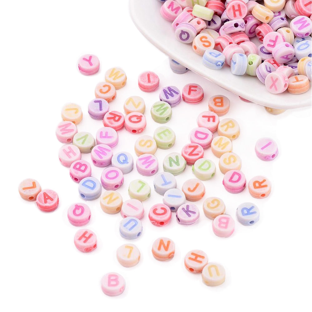 Acrylic Alphabet Spacer Beads, Mixed Color on a White base. Initial Spacers for DIY Jewelry Making Projects. Colorful Mixed Letter Shaped Spacers for Beading Projects. Size: 7mm Diameter, 3.5mm Thick, Hole: 2mm, approx. 400pcs/package. Material: Acrylic Initial Spacer Beads. Flat Round Shape, Mixed Color Alphabet Beads. White Flat Round Beads with Mixed Color Letters. bead lot