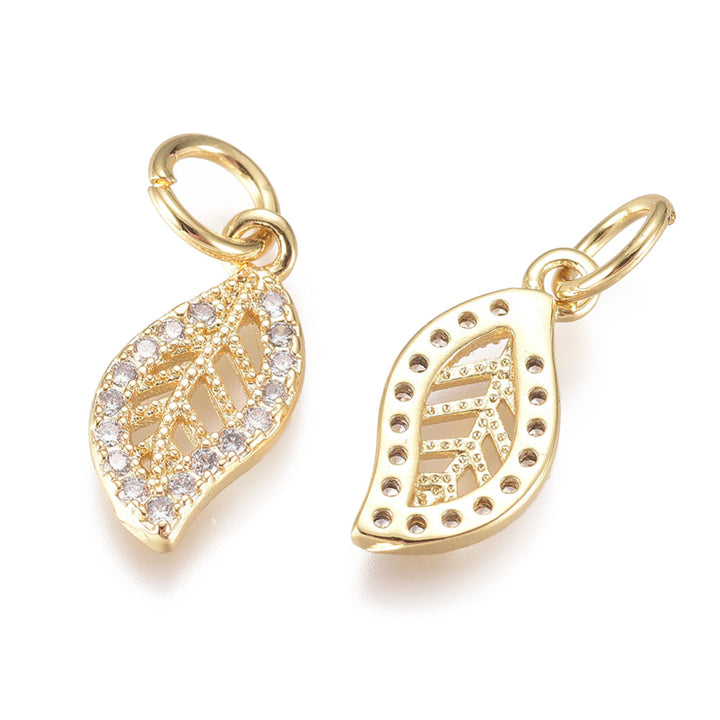 18K Gold Plated Cubic Zirconia Leaf Shaped Charms for DIY Jewelry Making.  Size: 13mm Length; 6mm Width; 1mm Thick; Hole: 3mm, 1pcs/package.  Material: 18K Light Gold Plated Brass Micro Pave Cubic Zirconia Charms, Clear Cubic Zirconia & Real Light Gold Plated Tarnish Resistant Charms.