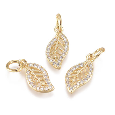 18K Gold Plated Cubic Zirconia Leaf Shaped Charms for DIY Jewelry Making.  Size: 13mm Length; 6mm Width; 1mm Thick; Hole: 3mm, 1pcs/package.  Material: 18K Light Gold Plated Brass Micro Pave Cubic Zirconia Charms, Clear Cubic Zirconia & Real Light Gold Plated Tarnish Resistant Charms.