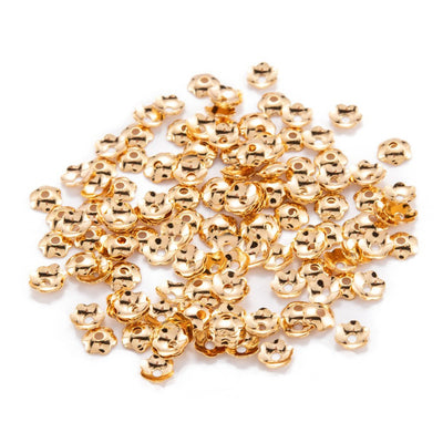 Achieve a beautiful and luxurious look for your jewelry pieces with these 18K light gold plated bead caps! Crafted out of brass with 6 petal flower shapes, these 4mm caps add a touch of sparkle and shine that takes your designs to a whole new level! Get 100pcs/bag of these gorgeous bead caps and make your jewelry stand out.  Size: 4x1mm; approx. 100 pcs/package  Material: 18K Light Gold Plated Brass