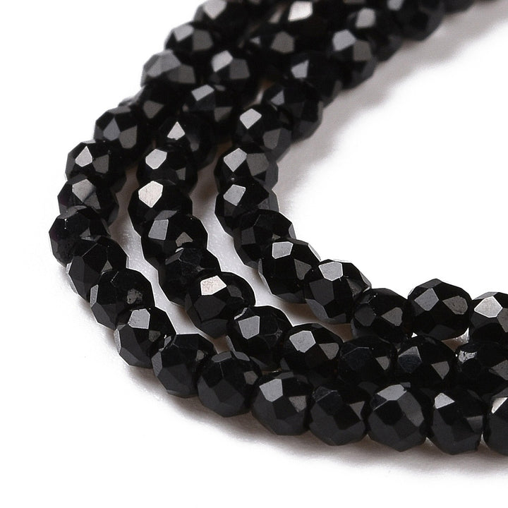 Faceted Glass Crystal Beads, Round, Black Color Beads.

Size:&amp;nbsp;2mm in Diameter, Hole: 0.8mm; approx. 150-165pcs/strand, 13" inches long.

Material: Transparent Faceted, Round, Black Color Glass Crystal Beads.