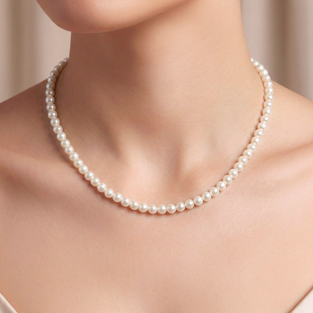 This timeless White Pearl Beaded Necklace is made with 6mm glass pearl beads, antique gold jewelry findings, chain extender and clasp. Hand strung on strong nylon thread cord, this 16" long&amp;nbsp;necklace combines sophistication and style