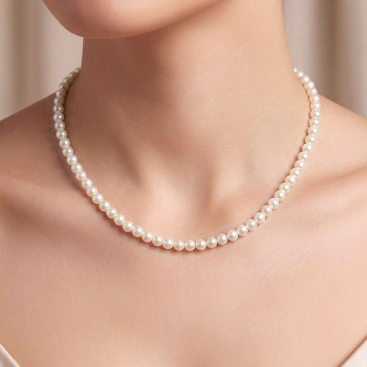 This timeless White Pearl Beaded Necklace is made with 6mm glass pearl beads, antique gold jewelry findings, chain extender and clasp. Hand strung on strong nylon thread cord, this 16" long&amp;nbsp;necklace combines sophistication and style