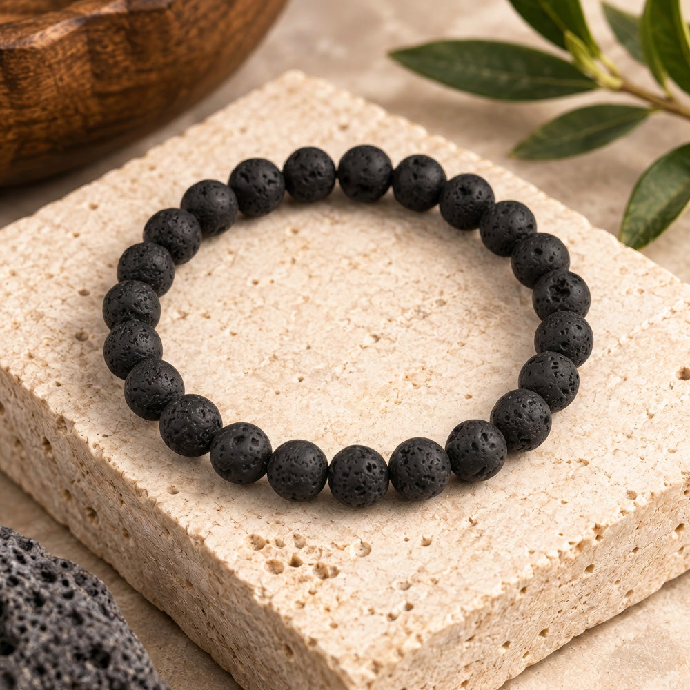 Black lava rock gemstone bracelet featuring 8mm beads in a timeless unisex design suited for both men and women. The natural volcanic stone brings grounding energy and emotional stability to the wearer, known in crystal traditions for promoting strength, courage, and calm during times of change. Lava rock&