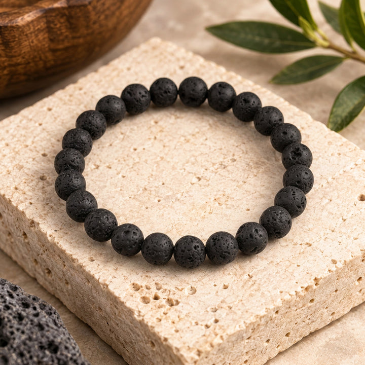 Black lava rock gemstone bracelet featuring 8mm beads in a timeless unisex design suited for both men and women. The natural volcanic stone brings grounding energy and emotional stability to the wearer, known in crystal traditions for promoting strength, courage, and calm during times of change. Lava rock&