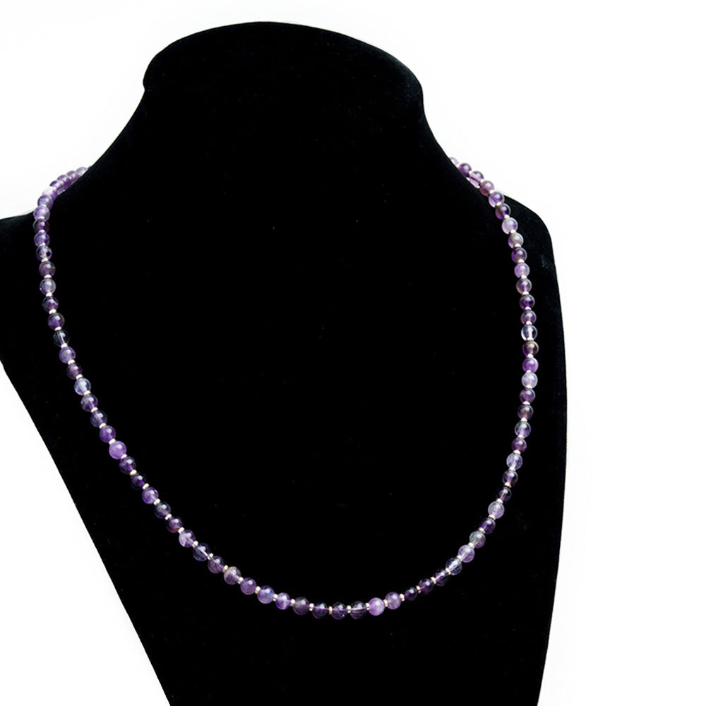 AMETHYS NECKLACE BEADED GEMSTONE NECKLACE. Hand strung with platinum silver plated jewelry findings and a 2" extender. 16" long necklace featuring heavenly purple hues complimented with platinum silver shine. Size: 16" Inch Necklace with 2: Extender Featuring 4mm Gemstone beads and 2mm Spacers. Material: Natural Amethyst Gemstone, Silver plated Hematite and Alloy Jewelry Findings