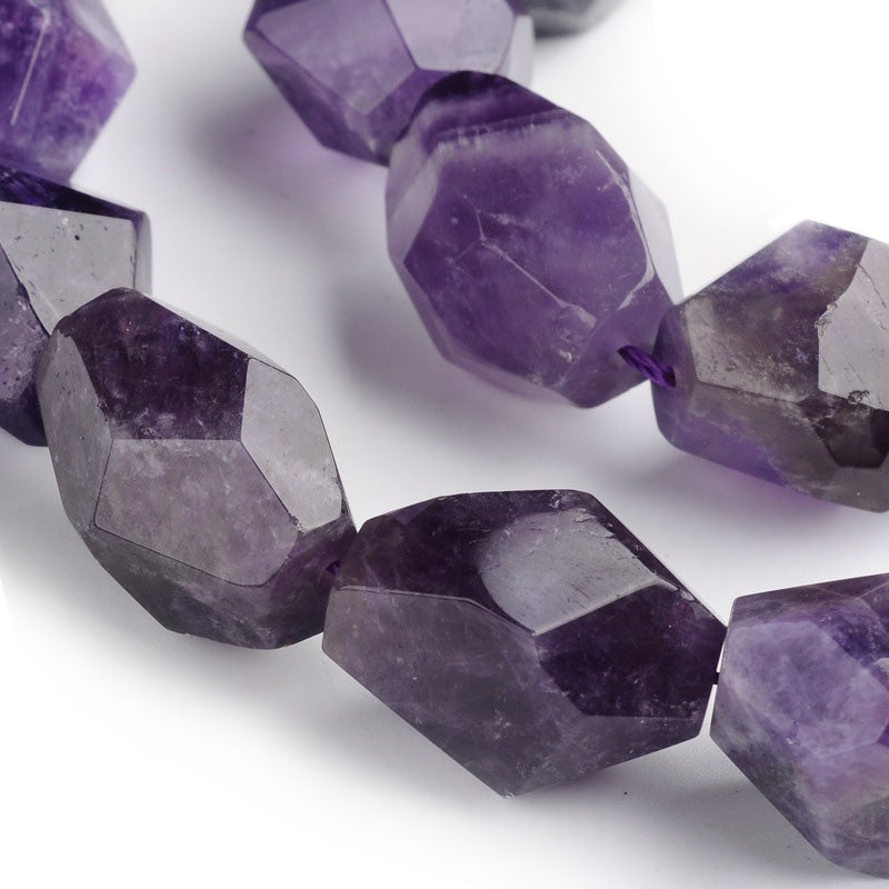 Discover the treasures of nature with these exquisite Amethyst Beads! These genuine gemstones sparkle in deep, dark and light purple hues, perfect for adding a magical touch to any jewelry design. With sizes ranging between 15-22x8-17mm, these large nuggets are sure to provide an eye-catching sparkle. Get creative and explore the beauty of these amazing semi-precious stones!