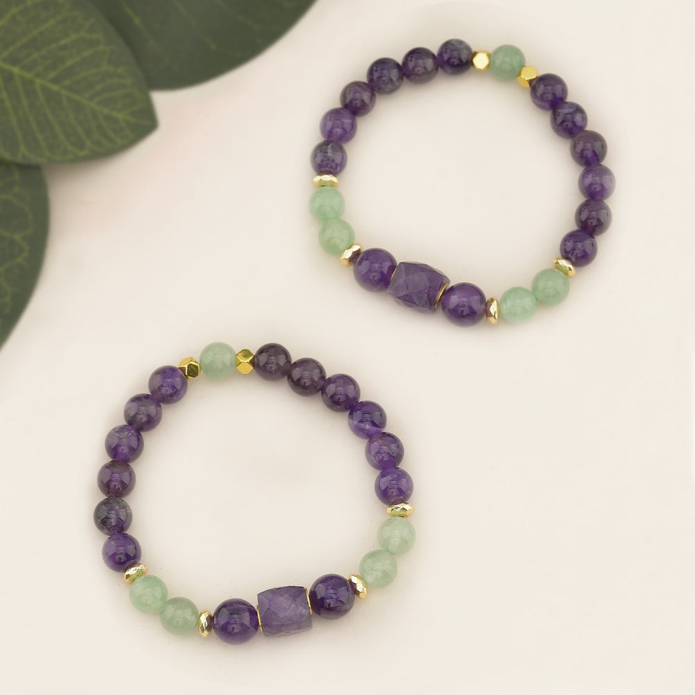 Amethyst &amp; Green Aventurine Beaded Gemstone Stretch Bracelet with Amethyst Centerpiece

This handcrafted Amethyst &amp; Green Aventurine Beaded Stretch Bracelet is a standout accessory featuring a beautiful 10x10mm faceted square amethyst bead as the focal point. Flanked by two 10mm amethyst beads, the centerpiece creates a balanced and eye-catching design. The bracelet also incorporates 8mm amethyst and green aventurine beads, along with 6mm gold faceted hematite accents, adding a touch of elegance.
