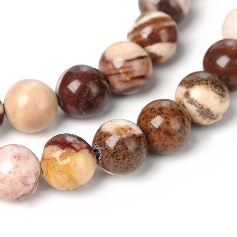 Australian Agate Beads, Round, Multi-Color Brown, Beige, Tan, Red Black Color. Semi-Precious Gemstone Beads for Jewelry Making.   Sizes:  6mm Diameter, Hole: 1mm; approx. 62pcs/strand, 14.5" Inches Long.  8mm Diameter, Hole: 1mm; approx. 46-48pcs/strand, 14.5" Inches Long.  Material: Natural Stone Australian Agate Beads. Polished, Shinny Finish.