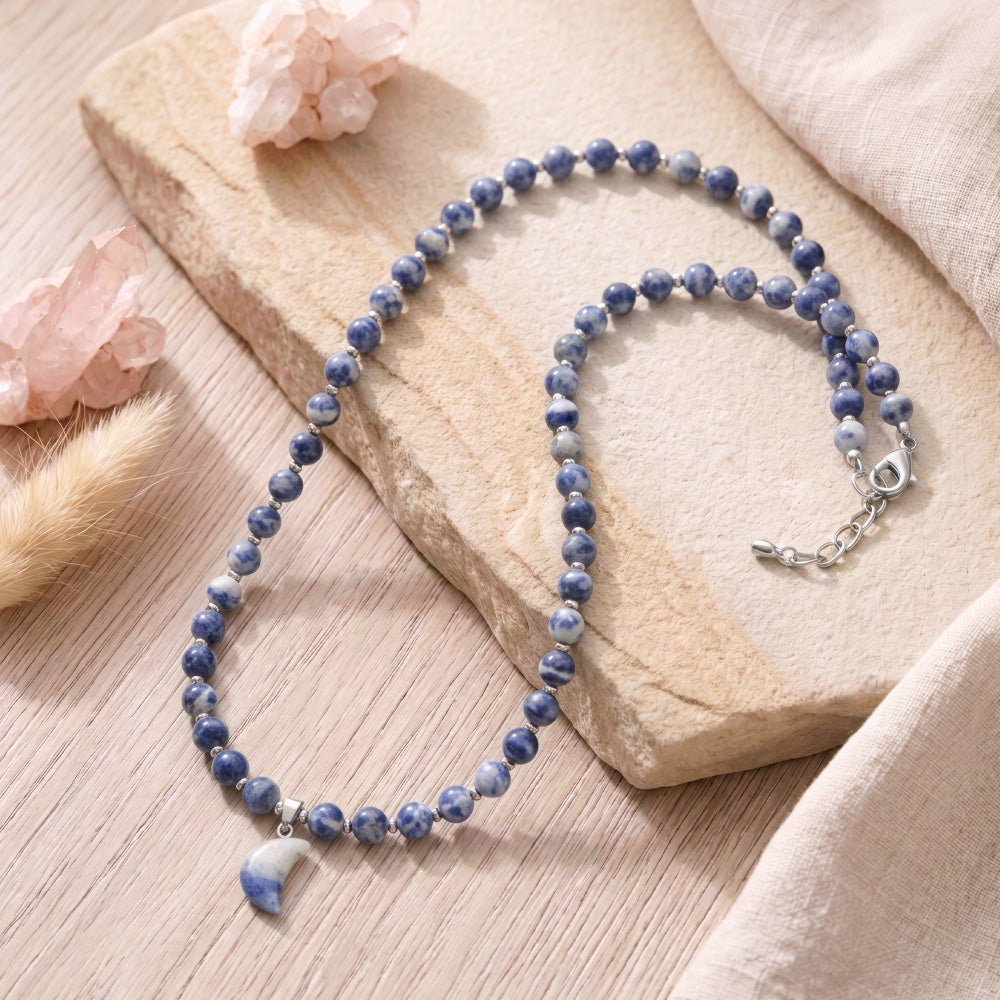 This Beaded Gemstone Necklace is a combination of Sodalite Beads and Blue Spot Jasper Pendant which stands out beautifully against the platinum-hued Stainless Steel spacers. Make a style statement with this unique, handcrafted necklace!