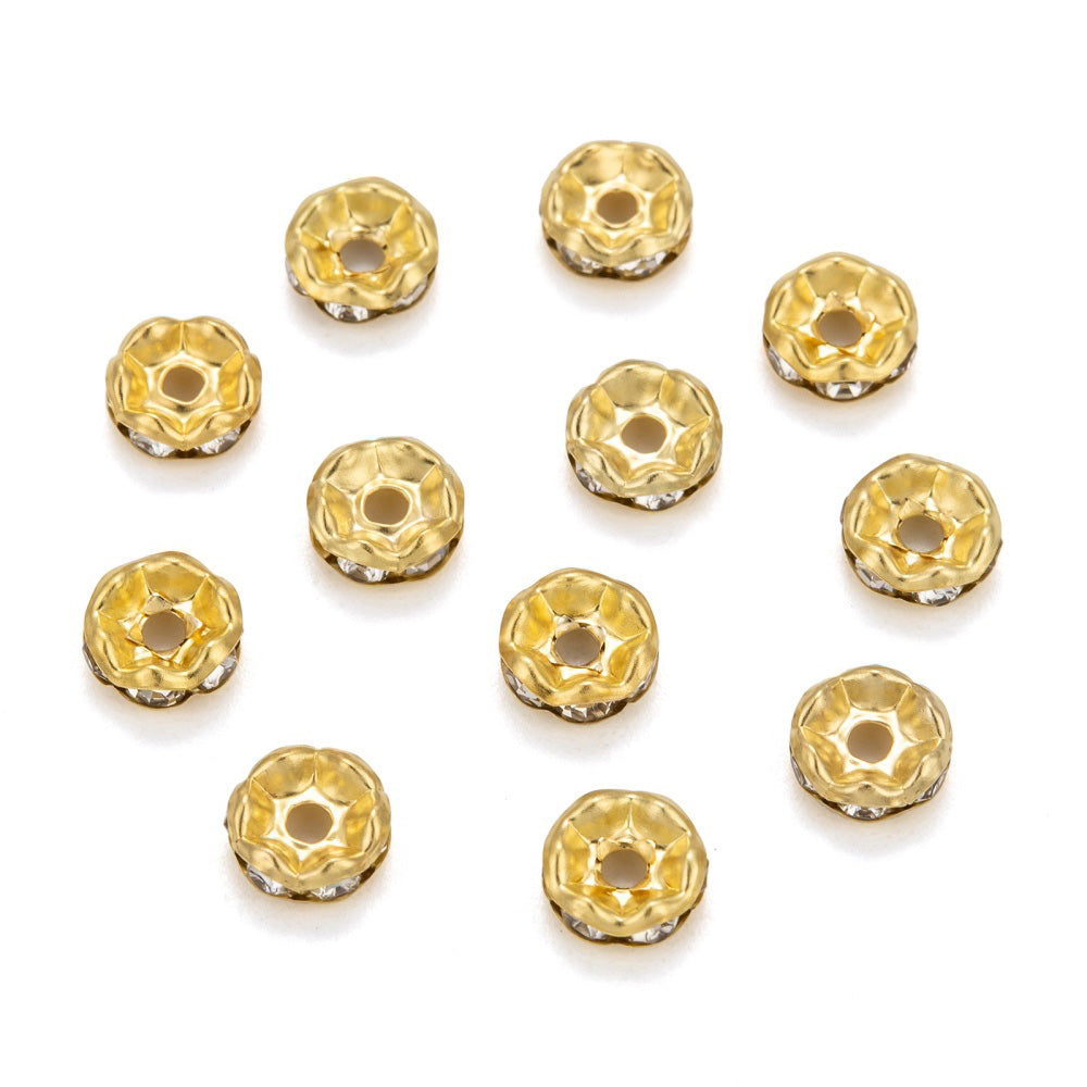 Silver Plated Brass Crystal Rondelle Rhinestone Spacer Beads, Wavy Edge, Shinny Gold Spacer Beads for DIY Jewelry Making. Add Some Shine and Sparkle to Your Creations.  Size: 8mm in Diameter, 3.5mm Thick, Hole Size: approx. 1.5mm, approx. 50pcs/bag.  Material: Brass Gold Plated Rondelle Spacer Beads. Wavy Edge. Each Spacer Bead Features 6 Clear Sparkling Mini Crystals. 