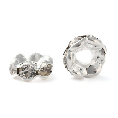 Silver Plated Brass Crystal Rondelle Rhinestone Spacer Beads, Wavy Edge, Shinny Silver Spacer Beads for DIY Jewelry Making. Add Some Shine and Sparkle to Your Creations.  Size: 6mm in Diameter, 3mm Thick, Hole Size: approx. 1.2mm, approx. 50pcs/bag.  Material: Grade "A" Brass Silver Plated Rondelle Spacer Beads. Wavy Edge. Each Spacer Bead Features 6 Clear Sparkling Mini Crystals. 
