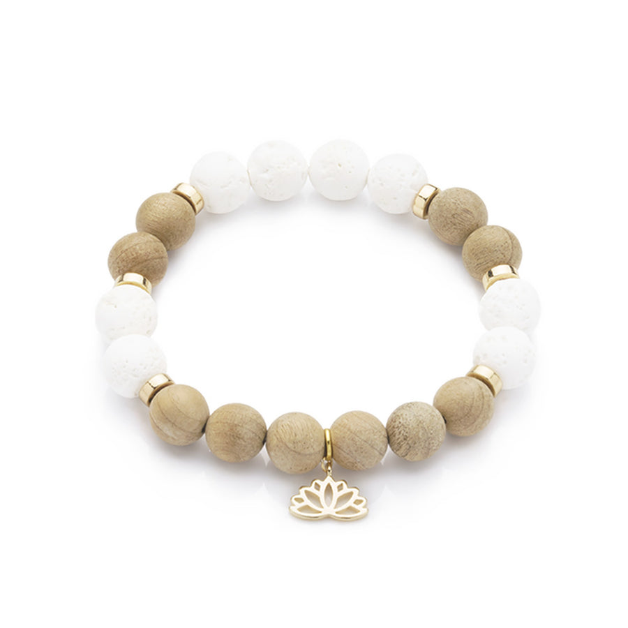 Accessorize your style with this Burlywood & White Lava Rock Beaded Bracelet! Featuring 10mm burlywood wooden beads, 10mm White Lava Rock Gemstone beads, 6mm light gold hematite disc spacer beads and 18K Gold Plated Lotus Charm. This beautiful beaded gemstone stretch bracelet is stackable, boho, and perfect for creating unique, eye-catching looks. Why not treat yourself today?  Size: 7.5" Inches