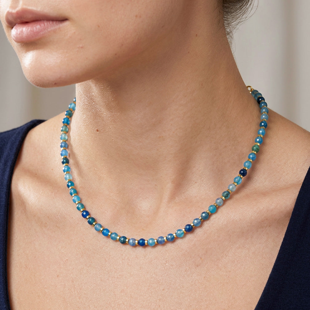 Crackle beads and 2mm gold plated hexagon shaped Hematite disc beads,&amp;nbsp;its delicate feminine&amp;nbsp;and is sure&amp;nbsp;to compliment your outfit. Hand strung with&amp;nbsp; gold&amp;nbsp; plated&amp;nbsp; jewelry findings and a 2" extender. 16" long necklace featuring multi color blue crackle beads complimented with gold shine.