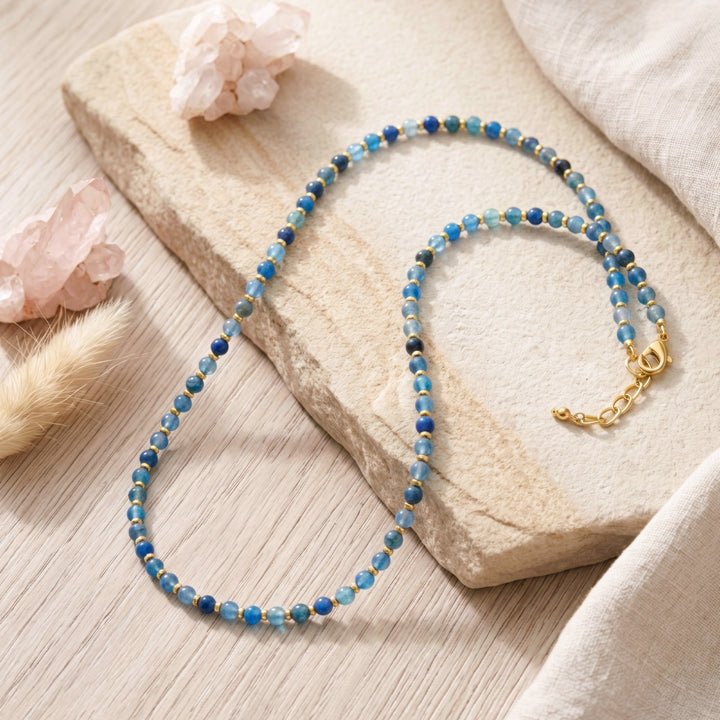 Look your best by day or night with this Blue Crackle Agate Beaded Gemstone Necklace! Showcasing 4mm Blue Agate