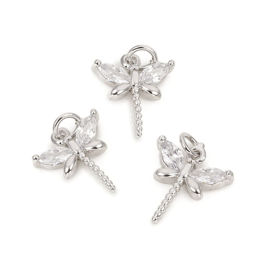 Bejewel away with these platinum-plated, dragonfly-shaped dazzlers! Fit for any project  Size: 11.8mm Length, 10.5mm Width, 2.5mm Thick, Hole: 1mm, Quantity: 1pcs/package.  Material: Brass Micro Pave Cubic Zirconia Dragonfly Charms. Platinum Color Dragonfly Shaped Pendant Charms for DIY Jewelry Making. 