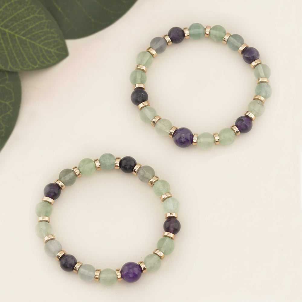 Revel in the beauty of our Amethyst &amp; Fluorite Beaded Gemstone Stretch Bracelet! 8mm Rainbow Fluorite and 10mm Amethyst Natural Stone Beads are simple yet stunning enough for everyday wear. Delicately strung on a stretchy elastic cord and embellished with Light Gold-Plated Hematite Spacer Beads; this bracelet fits wonderfully and slides off and on with ease