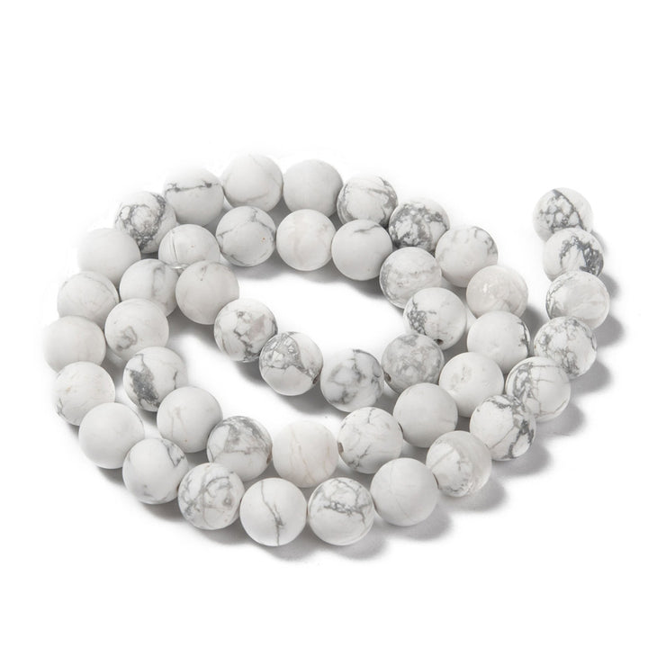 Frosted White Howlite Beads, Round. Matte Semi-precious Gemstone Howlite Beads for DIY Jewelry Making.   Sizes:  10mm Diameter; Hole: 1mm, approx. 36-37pcs/ strand 14" Inches Long.  8mm Diameter, Hole: 1mm, approx. 45-48pcs/strand, 14" Inches Long.  6mm Diameter, Hole:  0.8mm, approx. 58-60pcs/strand, 14" Inches Long.  4mm Diameter, Hole: 0.8mm, approx. 82-85pcs/strand 14" Inches Long  Material: Unpolished White Howlite; Frosted Stone Beads. White Color. Matte Finish. 