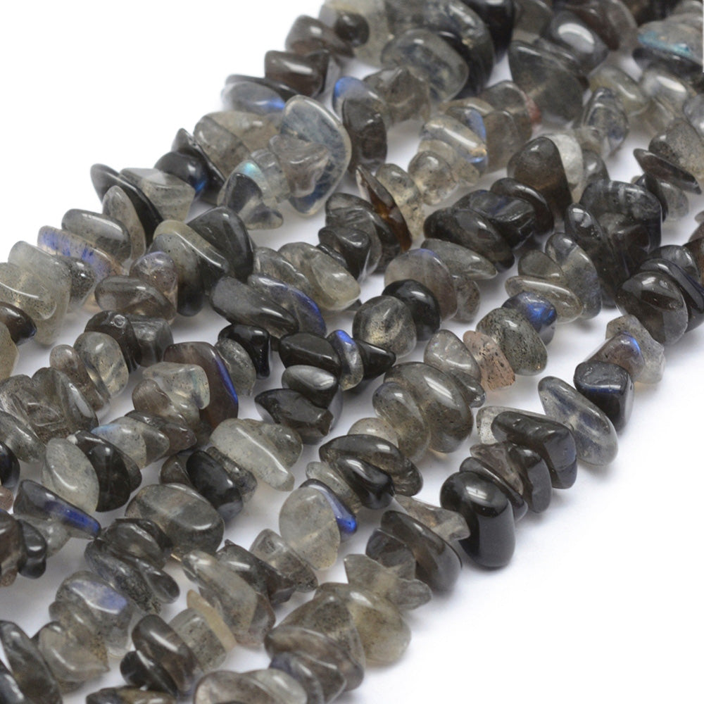 Grade A Natural Black Labradorite Chips, Grey Black Color Chips. Premium Grade Glimmering Labradorite Semi-Precious Stone Chip Beads for Jewelry Making.   Size: approx. 5~8mm wide, 5~8mm long, hole: 1mm; approx. 15" inches long.  Material: Premium Grade A Natural Labradorite Stone Beads. Greyish Black Colored Stone Chip Beads. Polished, Shinny Finish.