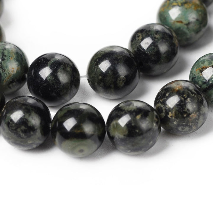 Kambaba Jasper Beads, Round, Green Color. Semi-Precious Gemstone Beads for Jewelry Making.   Sizes:  4mm Diameter, Hole: 1mm; approx. 47pcs/strand, 14.5" Inches Long.  6mm Diameter, Hole: 1mm; approx. 47pcs/strand, 14.5" Inches Long.  8mm Diameter, Hole: 1mm; approx. 44-46pcs/strand, 14.5" Inches Long.  Material: The Beads are Natural Kambaba Jasper Stone. Polished, Shinny Finish.