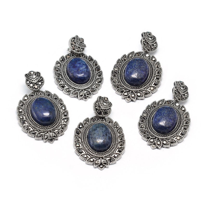 Alloy Antique Silver Rhinestone Gothic Lapis Lazuli Gemstone Pendants, Blue Color. Semi-precious Stone Goth Pendant for DIY Jewelry Making. Goth Style Jewelry Findings..   Size: 45-47mm Length, 25-27mm Width, 7.5-9mm Thick, Hole: 5x7mm, Qty: 1pcs/package.  Material: Natural Lapis Lazuli Stone Pendant Alloy and Rhinestone Findings. (Lead, Cadmium and Nickel Free Alloy Gothic Pendants.