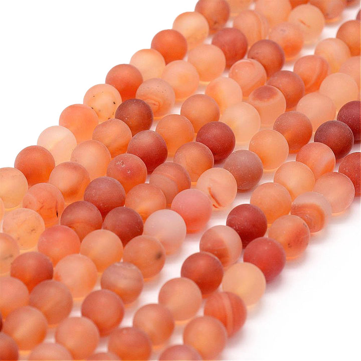 Natural Carnelian Matte Stone Beads, Round, Orange Red Color. Frosted Semi-Precious Gemstone Beads for DIY Jewelry Making.   Size: 8mm Diameter, Hole: 1mm; approx. 44-48pcs/strand, 15" Inches Long.  Material: Natural Carnelian Stone Beads. Variance of Orange and Red Color. Matte Unpolished Finish.   Carnelian Properties: Carnelian Stone Symbolizes Bold Energy, Warmth, and Joy. The Stone is also Associated with Courage, Leadership, Endurance and Motivation.