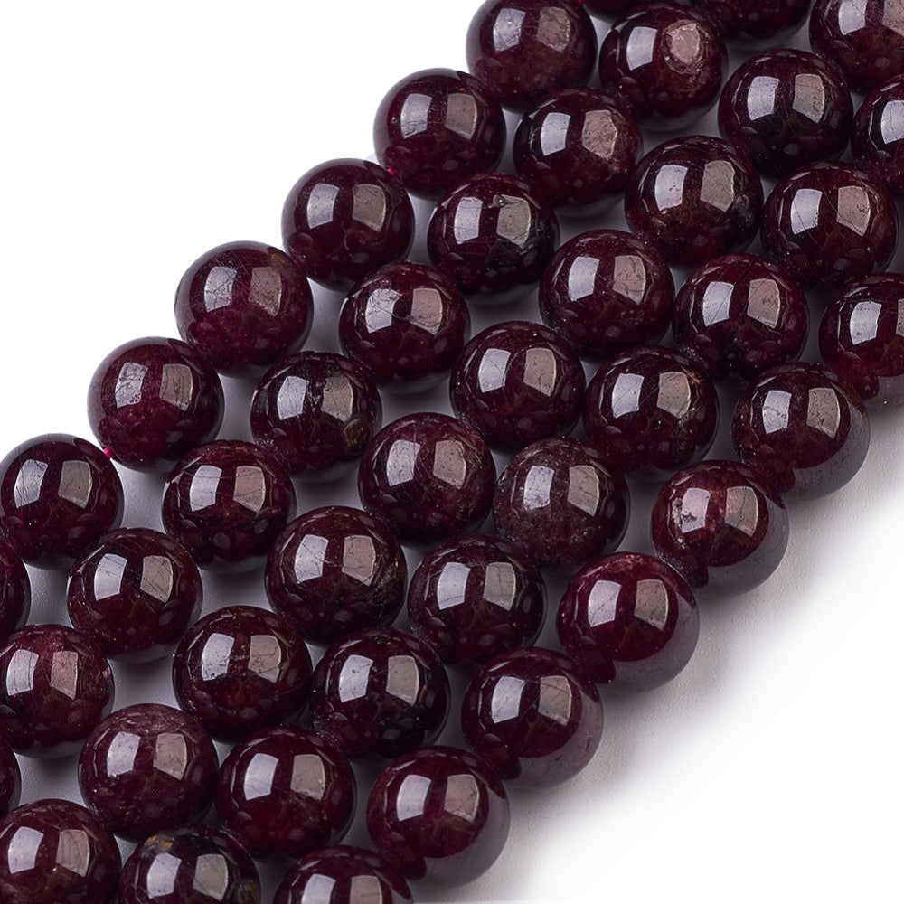    Glittering Dark Red Garnet Beads beckon to be made into stunning pieces of jewelry! These semi-precious gemstone beads are 8mm in diameter and have a 1mm hole, perfect for jewelry-making. Each strand contains approx. 47 polished beads that measure 14.5" in length. Embrace the beauty of genuine dark red garnet stone beads!  