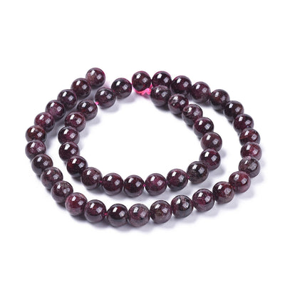    Glittering Dark Red Garnet Beads beckon to be made into stunning pieces of jewelry! These semi-precious gemstone beads are 8mm in diameter and have a 1mm hole, perfect for jewelry-making. Each strand contains approx. 47 polished beads that measure 14.5" in length. Embrace the beauty of genuine dark red garnet stone beads!  
