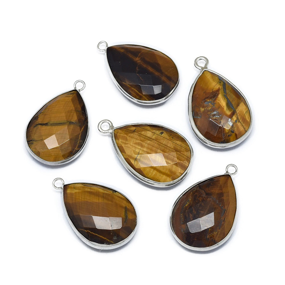 Material: Genuine Tiger Eye Stone Pendant, Platinum Color Brass Findings. Tear Drop Shaped Stone Pendants. Shinny, Polished Finish.   Make a statement with this Natural Tiger Eye Gemstone Pendant. The tear drop shape and natural iridescence draw the eye and are sure to turn heads. Featuring platinum plated brass findings, this pendant is perfect for creating unique jewelry pieces.