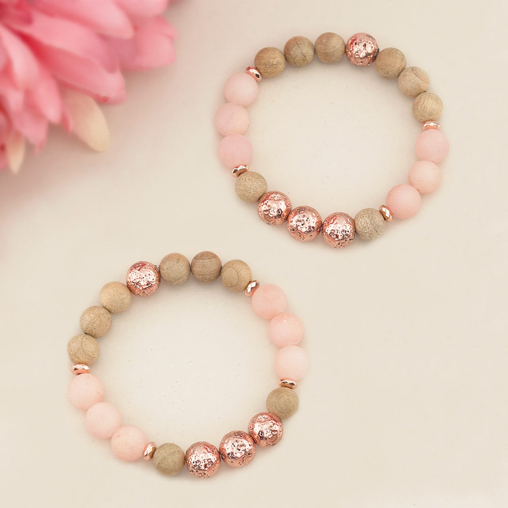 Two beaded bracelets with pink and brown beads on a light background: ROSE GOLD HEMATITE AND LAVA BEAD BARCELET WITH BURLYWOOD WOODEN BEADS STRETCH BRACELET