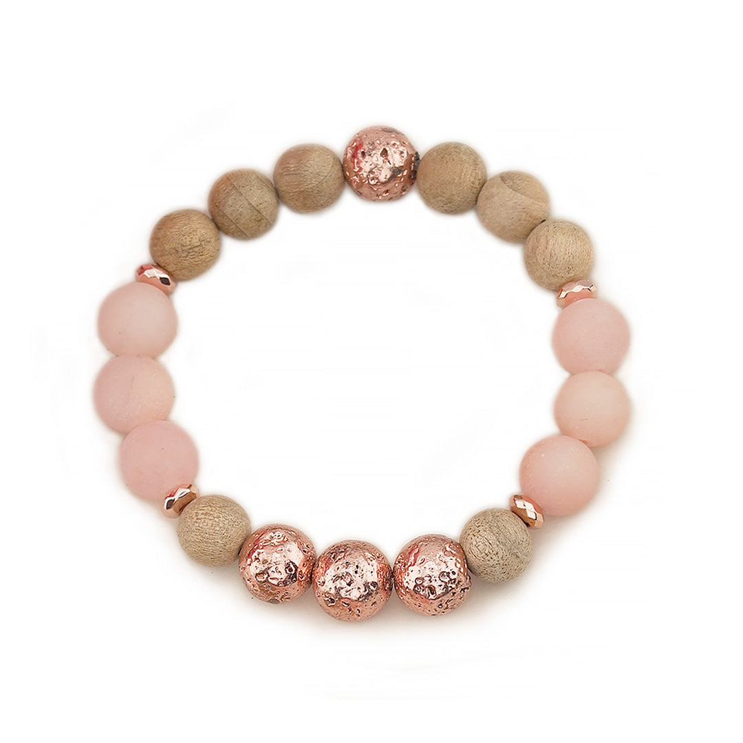 Matte Frosted Sunstone, Burlywood Wooden Beads &amp; Rose Gold Lava Rock Beaded Gemstone Stretch Bracelet.

This stylish&nbsp;Chunky Beaded Stretch Bracelet features a mix of 10mm 10mm Burlwood Wooden Beads,&nbsp; Matte Frosted Sunstone, and showcasing a 10mm Electroplated Rose Gold Lava Rock bead as the focal point. The bracelet is accented with 6mm Rose Gold Faceted Rondelle Hematite Beads.