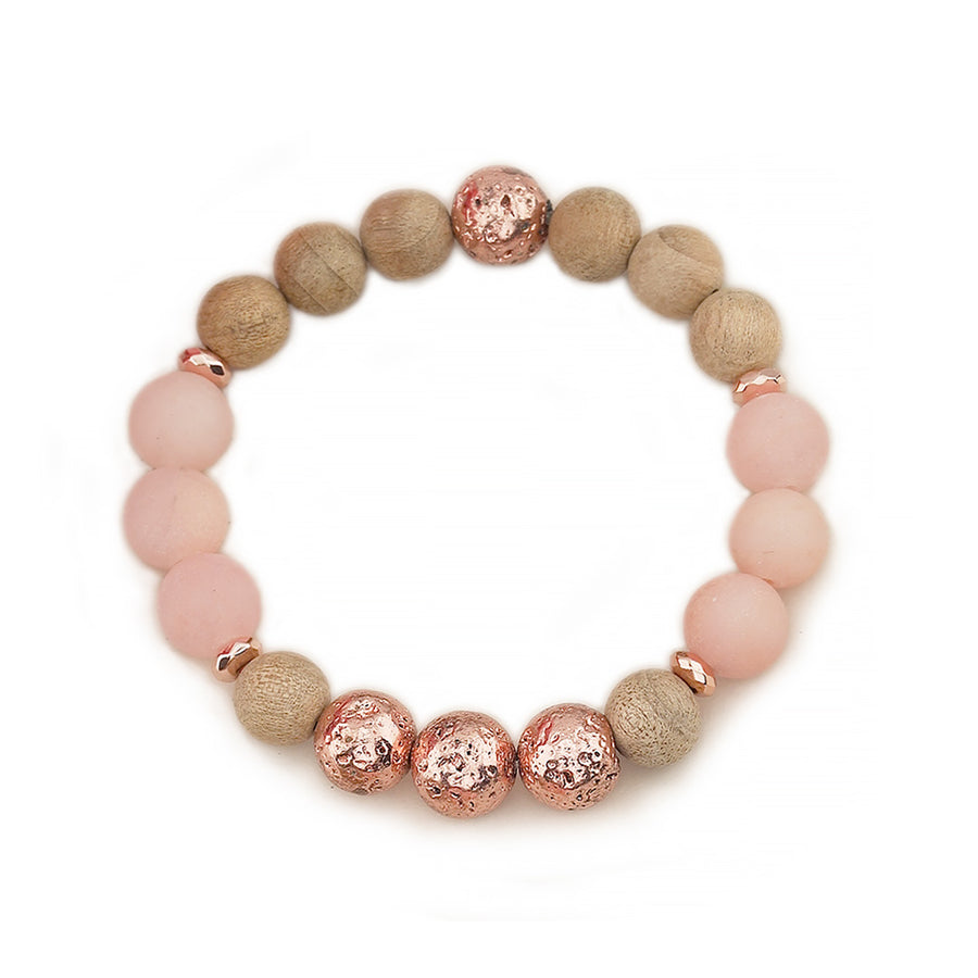 Matte Frosted Sunstone, Burlywood Wooden Beads &amp; Rose Gold Lava Rock Beaded Gemstone Stretch Bracelet.

This stylish&nbsp;Chunky Beaded Stretch Bracelet features a mix of 10mm 10mm Burlwood Wooden Beads,&nbsp; Matte Frosted Sunstone, and showcasing a 10mm Electroplated Rose Gold Lava Rock bead as the focal point. The bracelet is accented with 6mm Rose Gold Faceted Rondelle Hematite Beads.