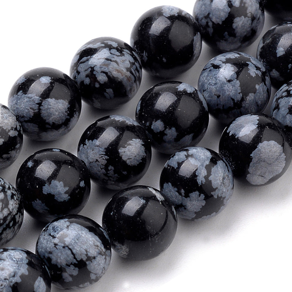 Snowflake Obsidian Beads, Black Color. Semi-precious Gemstone Beads for DIY Jewelry Making.   Size: 10mm Diameter, Hole: 1mm approx. 37pcs/strand, 15" Inches Long.  Material: Natural Snowflake Obsidian Stone Beads, Black Color. Shinny, Polished Finish. 