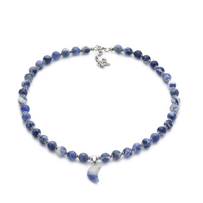 Look beautiful and feel powerful with this Sodalite Beaded Gemstone Necklace with its mesmerizing moon-shaped gemstone pendant. Crafted with 8mm blue Sodalite beads and16-inch length, it's the perfect way to showcase your unique style and express yourself.  Size: 16" Length with 2" Chain Extender. 8mm Gemstone Beads.  Material: Natural Sodalite & Blue Spot Jasper with Platinum Colored Stainless Steel Spacers. 