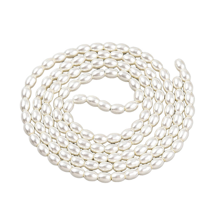 Rice Pearls, Glass Pearl Beads, Oval, Creamy White Color Pearls Beads for Jewelry Making.

Size: 6mm Length, 4-4.5mm With, Hole: 0.9mm, approx. 132pcs/strand, 30 inch/strand.

Material: The Beads are Made from Glass. Creamy White Color, Pearlized, Shinny Finish.