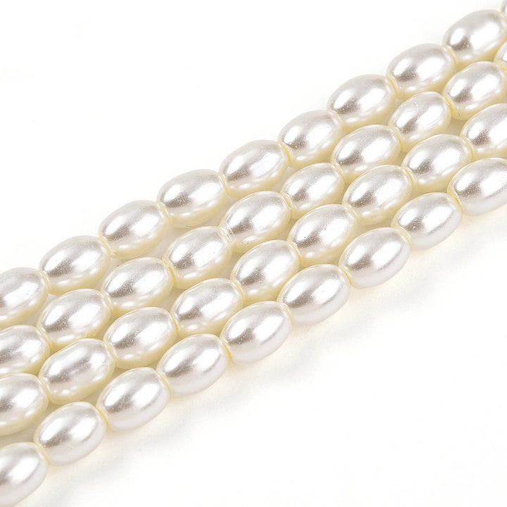 Rice Pearls, Glass Pearl Beads, Oval, Creamy White Color Pearls Beads for Jewelry Making.

Size: 6mm Length, 4-4.5mm With, Hole: 0.9mm, approx. 132pcs/strand, 30 inch/strand.

Material: The Beads are Made from Glass. Creamy White Color, Pearlized, Shinny Finish.