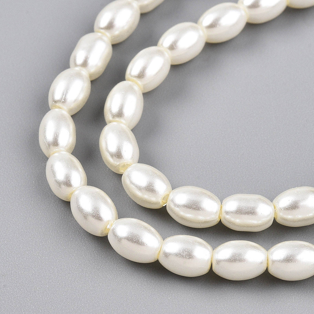 Rice Pearls, Glass Pearl Beads, Oval, Creamy White Color Pearls Beads for Jewelry Making.

Size: 6mm Length, 4-4.5mm With, Hole: 0.9mm, approx. 132pcs/strand, 30 inch/strand.

Material: The Beads are Made from Glass. Creamy White Color, Pearlized, Shinny Finish.