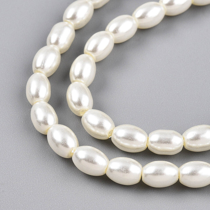 Rice Pearls, Glass Pearl Beads, Oval, Creamy White Color Pearls Beads for Jewelry Making.

Size: 6mm Length, 4-4.5mm With, Hole: 0.9mm, approx. 132pcs/strand, 30 inch/strand.

Material: The Beads are Made from Glass. Creamy White Color, Pearlized, Shinny Finish.