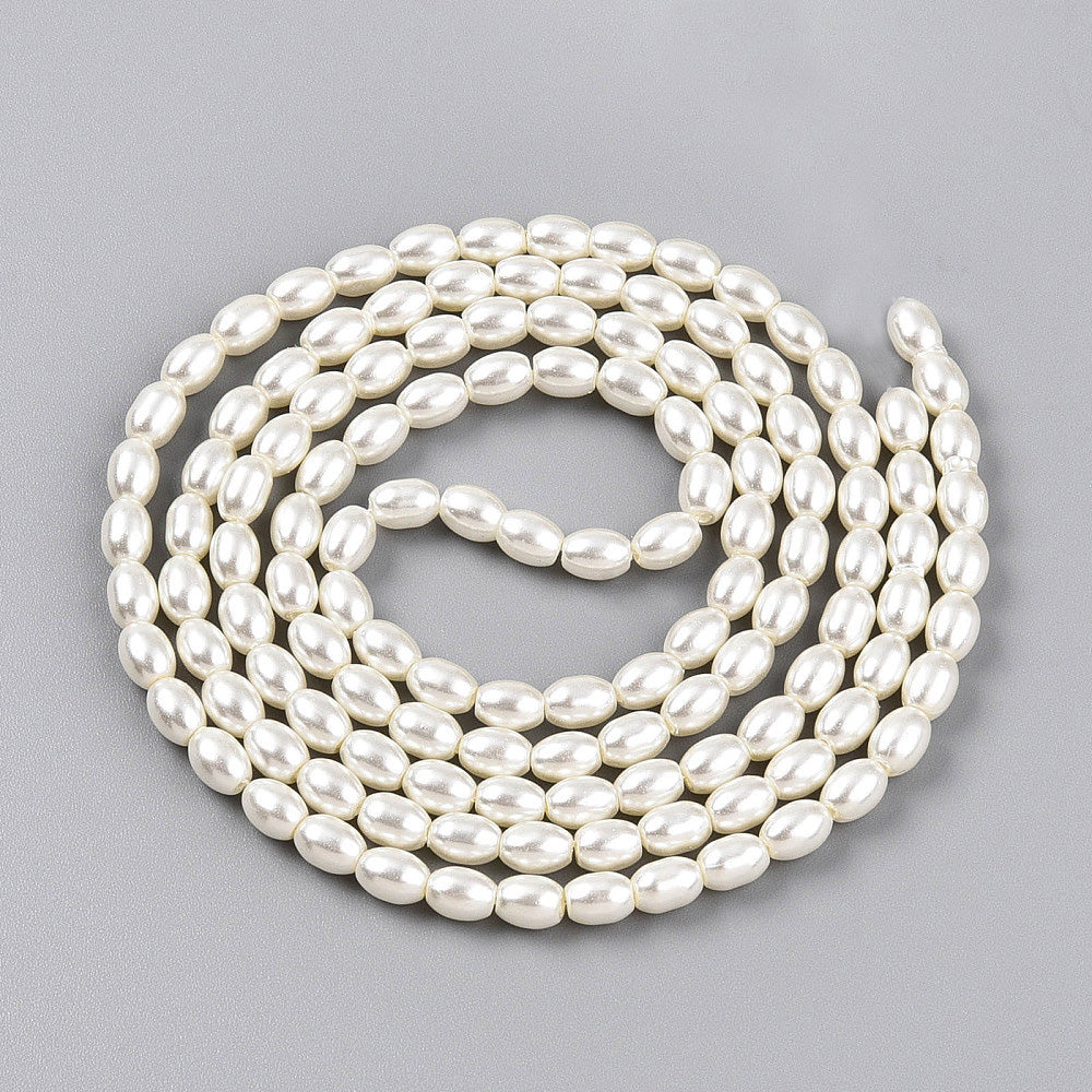 Rice Pearls, Glass Pearl Beads, Oval, Creamy White Color Pearls Beads for Jewelry Making.

Size: 6mm Length, 4-4.5mm With, Hole: 0.9mm, approx. 132pcs/strand, 30 inch/strand.

Material: The Beads are Made from Glass. Creamy White Color, Pearlized, Shinny Finish.