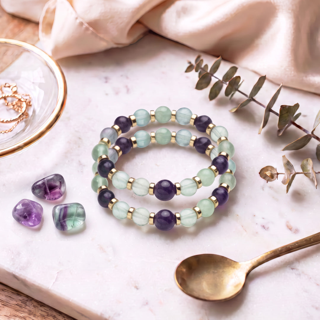 Revel in the beauty of our Amethyst &amp; Fluorite Beaded Gemstone Stretch Bracelet! 8mm Rainbow Fluorite and 10mm Amethyst Natural Stone Beads are simple yet stunning enough for everyday wear. 