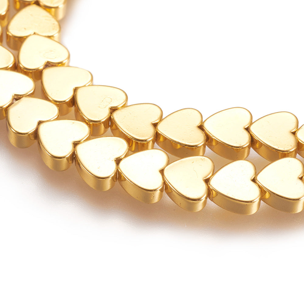Gold Plated Non-Magnetic Synthetic Hematite Heart Beads for Jewelry Making.   Size: 6mm Length, 5mm Width, 2mm Thick, Hole: 1mm, approx. 80-83pcs/strand, 15.5" Inches Long.