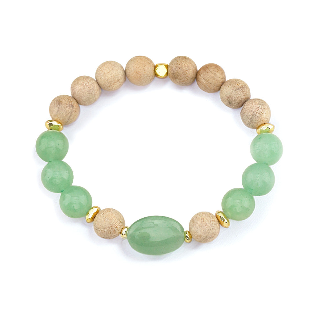 A harmonious blend of earthy natural wood grain and vibrant green aventurine, finished with gleaming gold-tone hematite accents and an elegant oval focal stone.

Featuring a balance of rich, textured burlywood beads and smooth green aventurine, this piece pairs warm organic tones with the refreshing quartz hues of natural stone.

At the center sits a polished 17×10mm oval green aventurine focal bead, flanked by metallic gold-plated hematite spacer accents that catch the light with every movement. Built on a