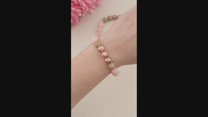 Matte Frosted Sunstone, Burlywood Wooden Beads &amp; Rose Gold Lava Rock Beaded Gemstone Stretch Bracelet.

This stylish&nbsp;Chunky Beaded Stretch Bracelet features a mix of 10mm 10mm Burlwood Wooden Beads,&nbsp; Matte Frosted Sunstone, and showcasing a 10mm Electroplated Rose Gold Lava Rock bead as the focal point. The bracelet is accented with 6mm Rose Gold Faceted Rondelle Hematite Beads.

