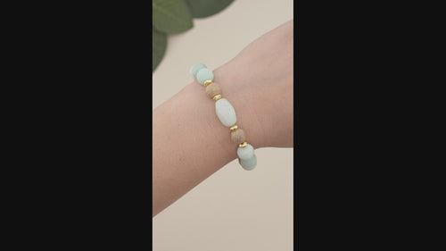 Amazonite &amp; Burlywood Wooden Beaded Gemstone Stretch Bracelet with Amazonite Centerpiece.

Elevate your style with this handcrafted Amazonite &amp; Burlywood Wooden Beaded Stretch Bracelet, featuring a striking faceted oval Amazonite centerpiece. Designed with a combination of 10mm Burlywood wooden beads, 10mm frosted Amazonite gemstone beads, and accented with 6mm gold faceted hematite rondelles and a 6mm gold square bead, this bracelet offers a harmonious blend of earthy tones and elegance.