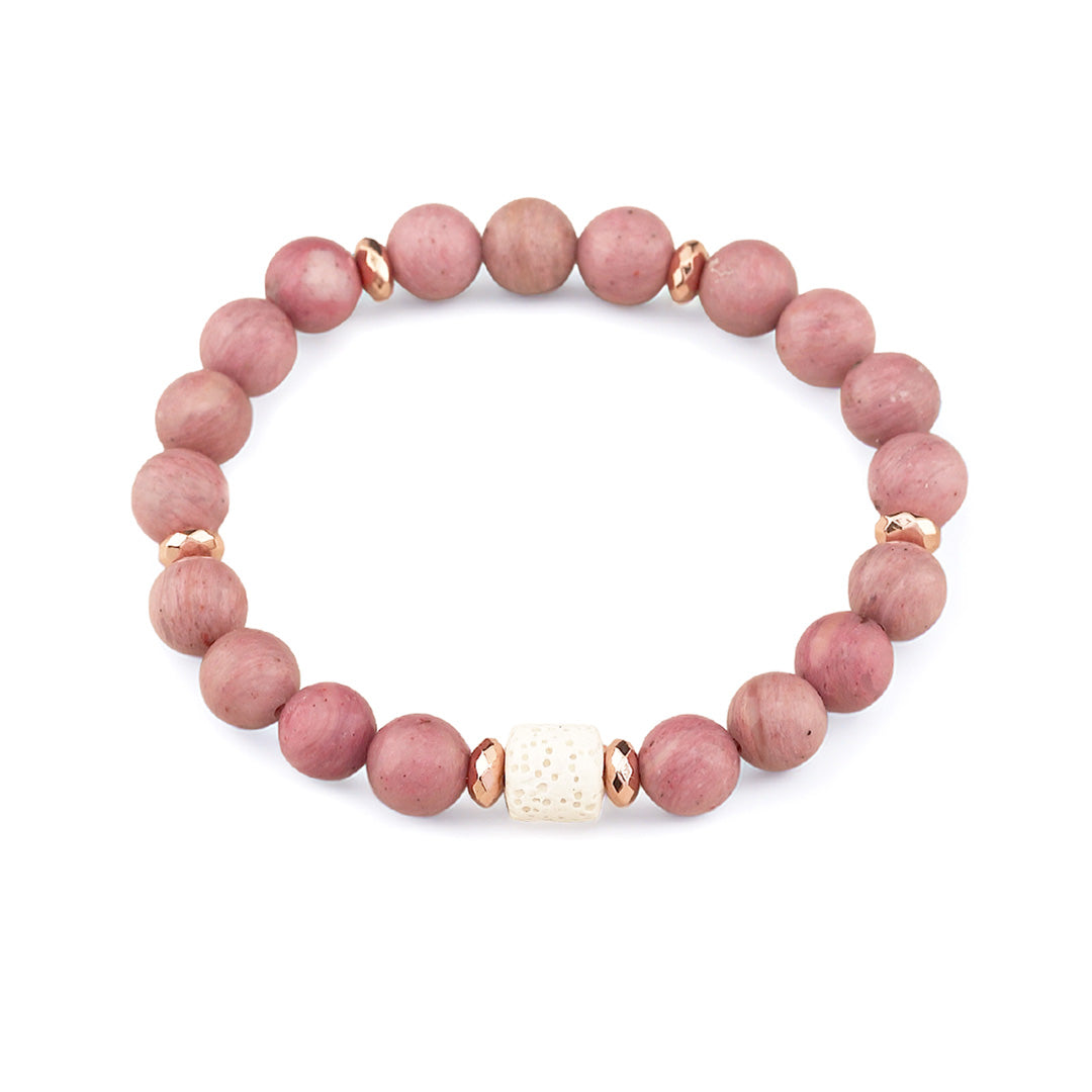 This handmade rhodonite bracelet combines 8mm rhodonite beads with a striking white lava rock focal bead and rose gold hematite spacer accents for a design that balances natural beauty with refined elegance. Perfect for everyday wear or as a meaningful gift for someone on a healing journey.